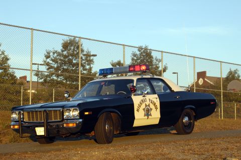 1973 Dodge 1500 - This 1973 Dodge 1500 police car features a light bar and distinctive grille.
