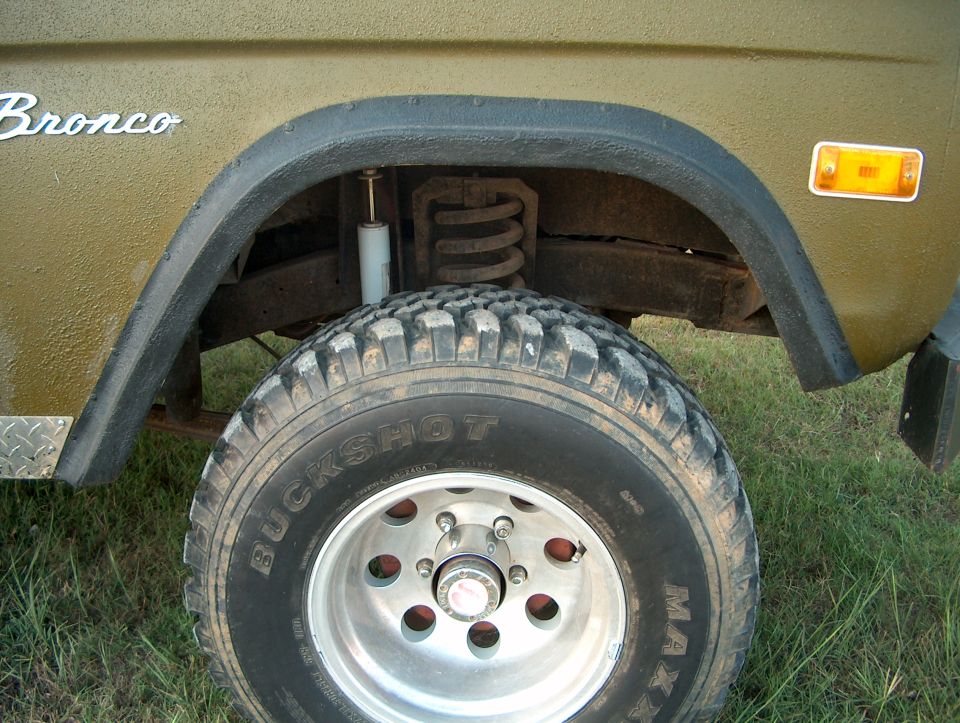 1979 Ford Bronco side view showing front wheel, fender, and "Bronco" badge