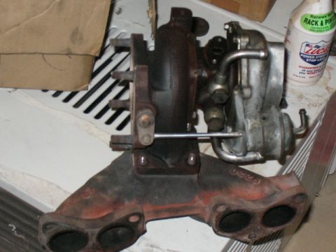 2001 Pontiac Trans Am - A turbocharger and exhaust manifold assembly is shown, with some part numbers visible on the components.