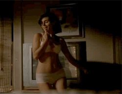 1987 Suzuki Samurai - A woman stands in a room wearing undergarments.