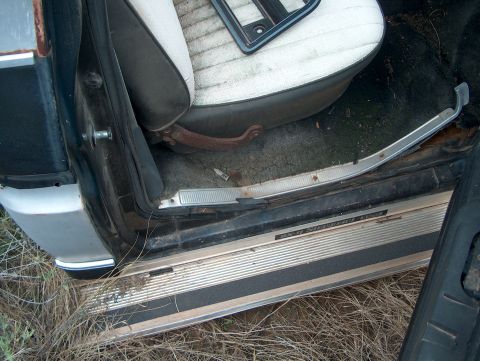 1979 Ford Bronco - Interior view of a 1979 Ford Bronco, showing the door sill and seat.