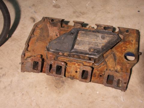 1965 Ford Mustang - This heavily rusted exhaust manifold is a vehicle part, not a complete vehicle.