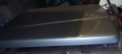 1974 Ford Bronco - A silver car hood is shown, likely a replacement part, with no vehicle visible.