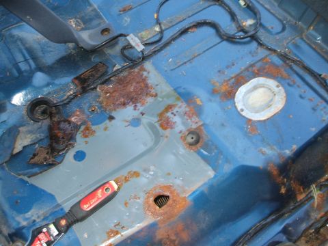 1990 Ford Bronco - Here was the only rust/bad spot. Well hidden right under the drivers seat. Will have to do some patch and welding.
