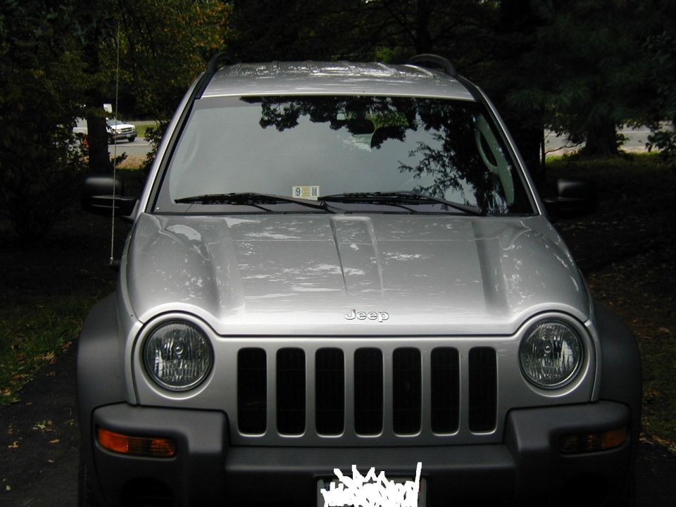 Silver 2004 Jeep Liberty front view, parked outdoors