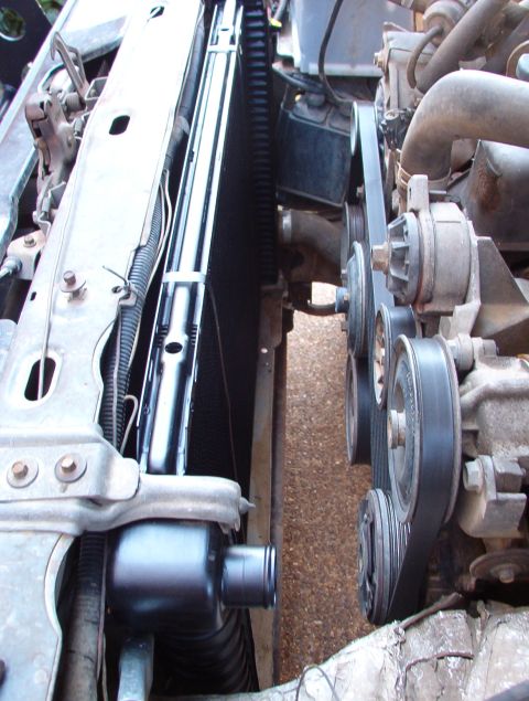 1983 Ford Bronco - Mmmmmm... New (free) radiator. 8) Now I can see that the t-stat housing gasket is leaking. :(