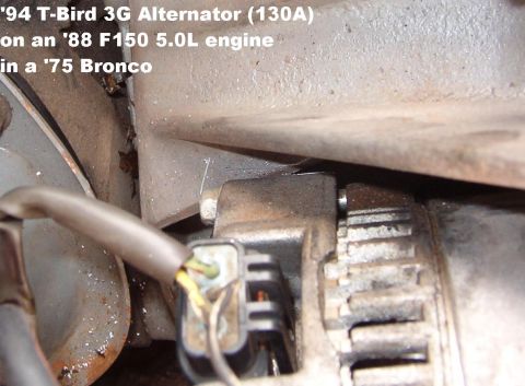 1975 Ford Bronco - The case hits this rib of the bracket, preventing the top bolt from aligning. The scratch is where I plan to cut it. GO TO THE NEXT PIC.