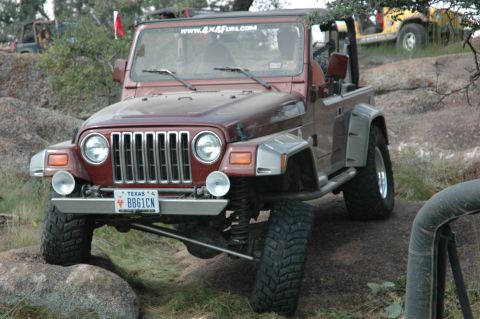 2001 Jeep Wrangler - This 2001 Jeep Wrangler navigates a rocky off-road course, displaying its Texas license plate.