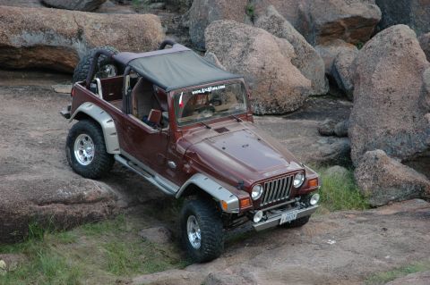 2001 Jeep Wrangler - This Jeep Wrangler is navigating a rocky terrain.