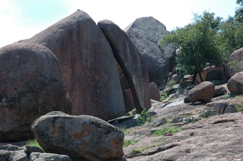 2001 Jeep Wrangler - A natural scene large rock formations and vegetation, with no vehicles present.