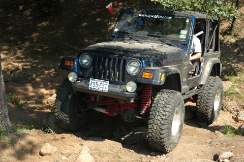 2001 Jeep Wrangler - 2001 Jeep Wrangler navigating a challenging off-road course.