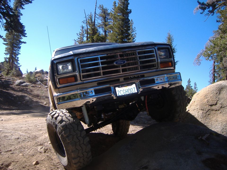 1980 Ford Bronco front view, tires on rocks, off-road