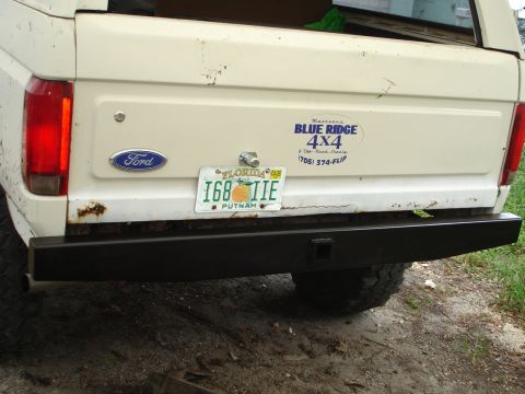1989 Ford Bronco - Rear view of a white Ford Bronco showing its bumper and license plate.