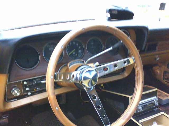 1979 Ford Ranchero interior with wood-grain dash and aftermarket steering wheel