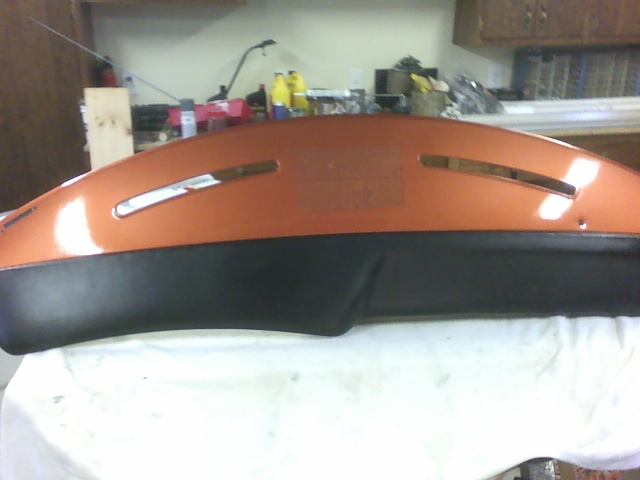 Orange and black dashboard section with two horizontal vents