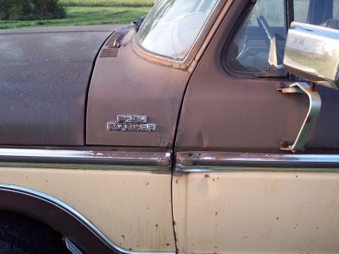 1978 Ford F-250 - Close-up of a weathered Ford F-250 Ranger truck, revealing its age and condition.