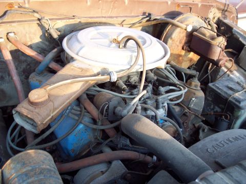 1978 Ford F-250 - Close-up view of a vehicle's engine bay, showing various engine components and wiring.