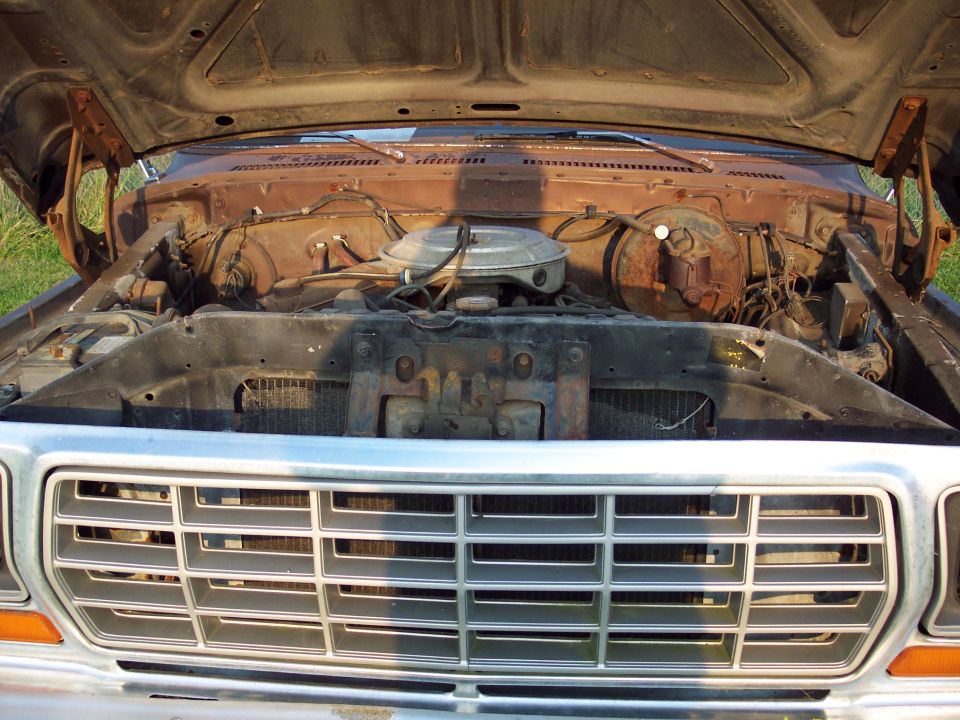 1978 Ford F-250 engine bay with hood open, showing engine and grille
