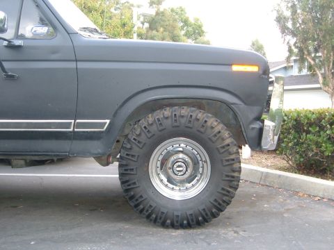 1981 Ford Bronco - A dark gray 1978 Ford Bronco is shown from the front quarter panel to the rear wheel.