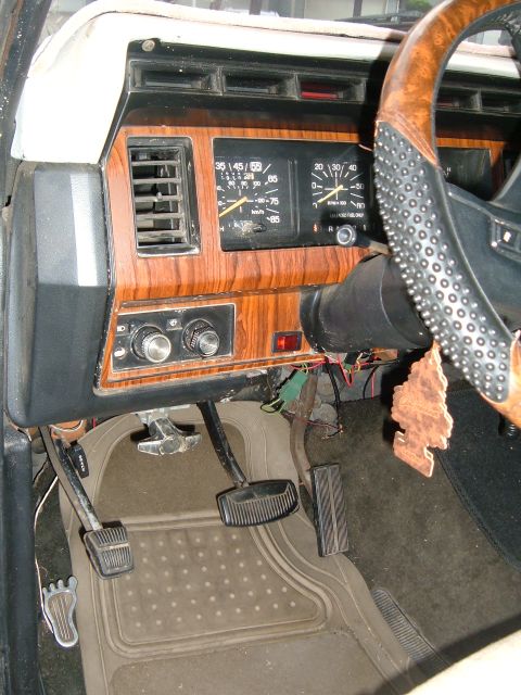 1981 Ford Bronco - Interior view of a 1981 Ford Bronco, showing the dashboard, steering wheel, and pedals.