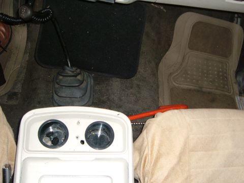 1981 Ford Bronco - deep style cup holders. Drilled out eh bottoms with a hole saw and then shoved these in.