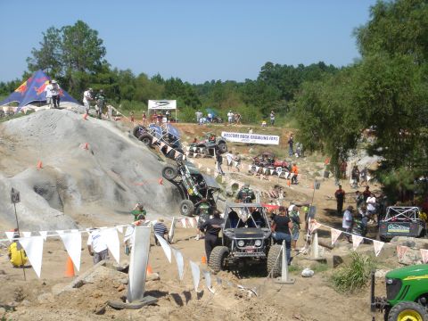 2002 Jeep Wrangler - Multiple custom off-road vehicles compete on a challenging rock crawling course.