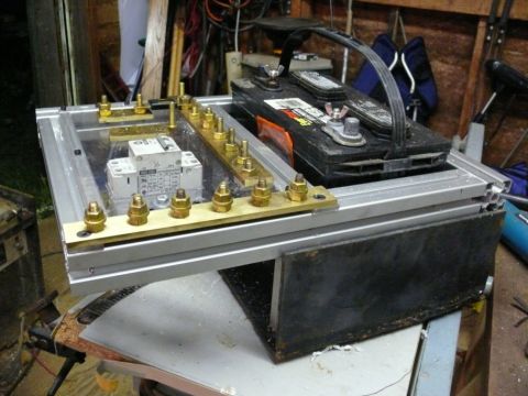1988 Ford Bronco - Custom battery box assembly bus bars and a circuit breaker, with a car battery mounted on top.