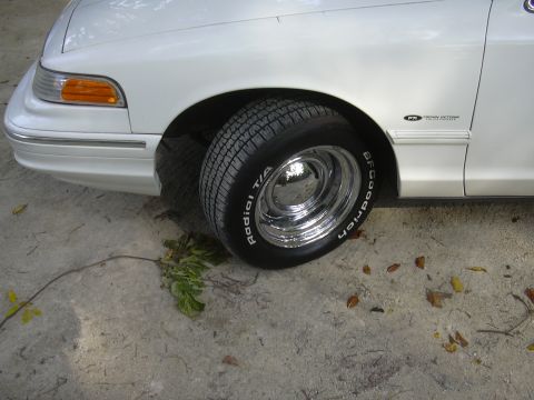 1997 Ford Crown Victoria - Close-up of the front fender and wheel of a 1997 Ford Crown Victoria.