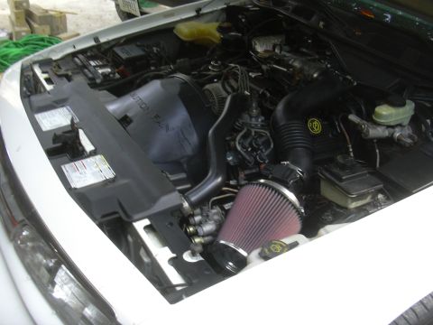 1997 Ford Crown Victoria - The engine bay of a 1997 Ford Crown Victoria is shown with an aftermarket air intake system.