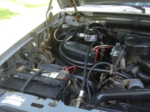 1997 Ford Crown Victoria - Close-up view of a vehicle's engine bay, showing various mechanical parts and wiring.
