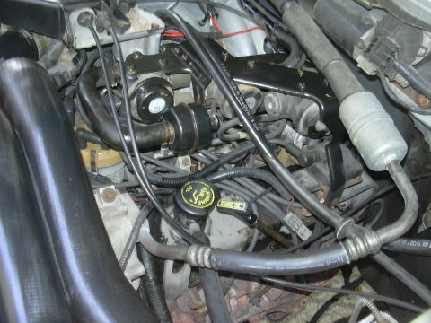 1997 Ford Crown Victoria - Close-up view of an engine bay, showing various mechanical parts and wiring.