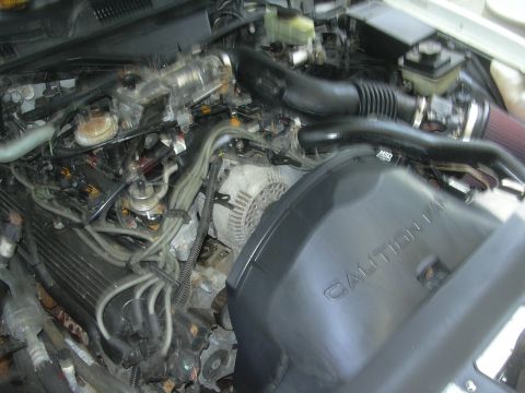 1997 Ford Crown Victoria - The engine bay shows an MSD intake system and a prominent "CAUTION" warning on a black cover.