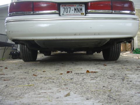 1997 Ford Crown Victoria - Rear view of a 1997 Ford Crown Victoria, focusing on the undercarriage and suspension. Wisconsin plate 707-MNM.