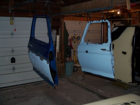 1979 Ford F-150 - Vehicle doors are prepared for painting in a garage setting.