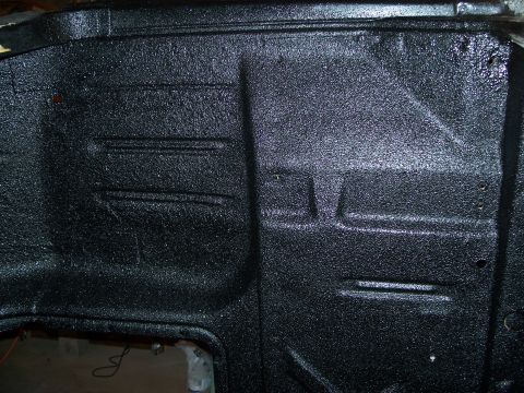 1979 Ford F-150 - Close-up view of a black textured interior panel, possibly from a truck bed or undercarriage.