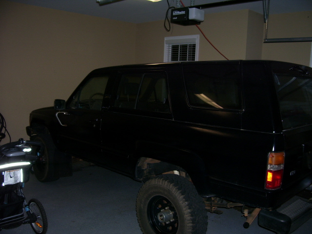 Black 1987 Toyota 4Runner parked in a garage, side view