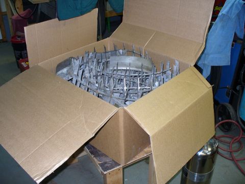 1978 Ford Bronco - H1 rims are pictured inside a cardboard box, ready for shipping or storage.