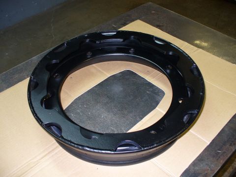 1978 Ford Bronco - A black rim with distinctive cutouts is shown, likely a replacement part.