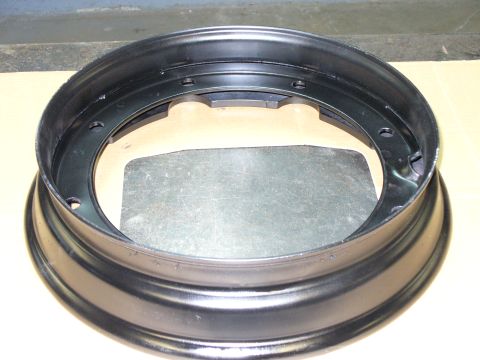 1978 Ford Bronco - Close-up of a black steel wheel rim, likely for an older truck or SUV.