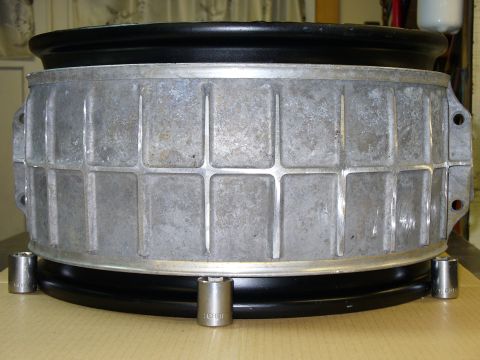 1978 Ford Bronco - A close-up view of a wheel rim, with socket wrenches placed around its base.