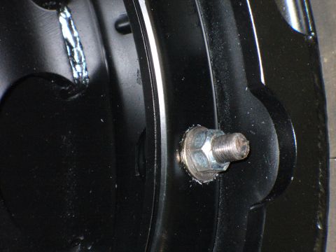 1978 Ford Bronco - Detail shot of a bolt and washer assembly on a black metal component.