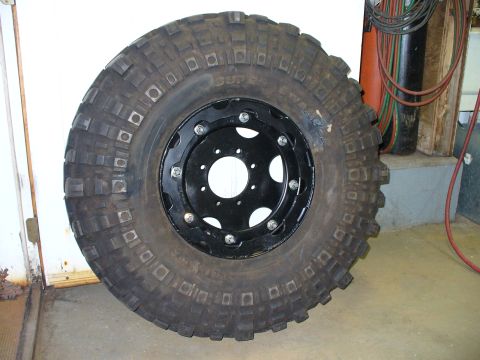 1978 Ford Bronco - A single off-road tire and rim assembly is shown, with visible text on the tire's sidewall.