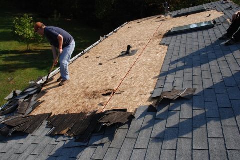 1996 Ford Bronco - Roof repair in progress, showing old shingles being removed and new ones installed.