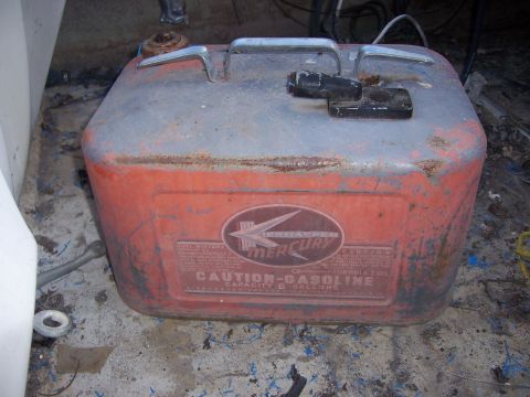 1991 Ford Bronco - A vintage Mercury 6-gallon fuel tank, likely for an outboard motor, shows significant wear and rust.