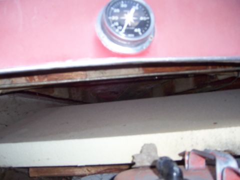 1991 Ford Bronco - A gauge is visible on a red surface, with wooden structures below.