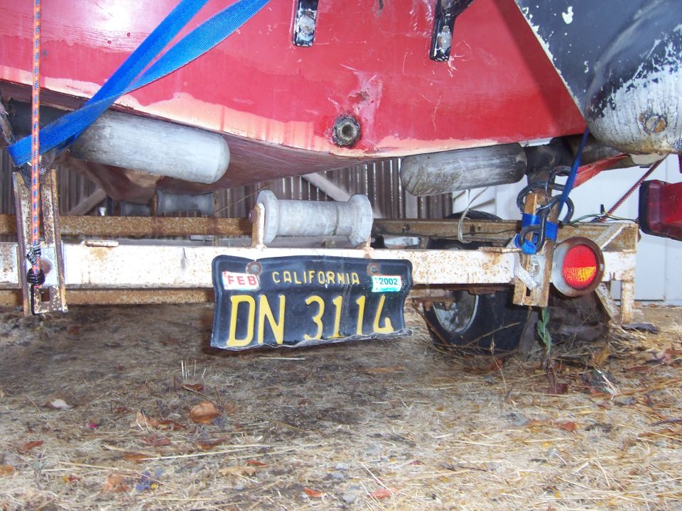 Boat on trailer with California license plate DN 3114 expiring Feb 2002