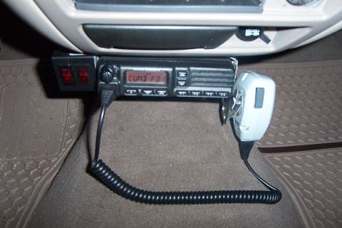 1998 Ford Crown Victoria - A CB radio with a microphone is installed in the vehicle's interior, along with auxiliary switches.