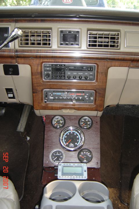 1989 Ford Crown Victoria LTD - Custom gauges and dashboard with wood trim are visible in this interior shot.