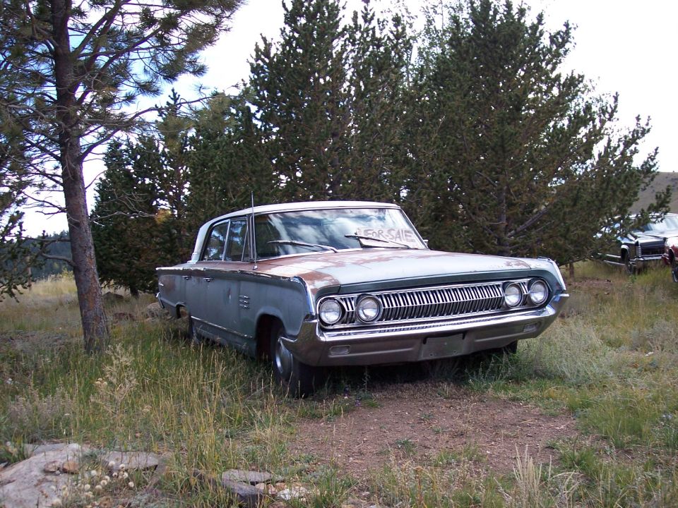 1965 Mercury Park Lane 3q-front view, light blue with white roof, "FOR SALE" sign on dash