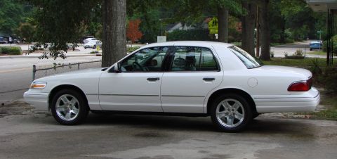 1997 Mercury Grand Marquis - Side View with LX-Sport Weels and 235/55-17 P-Zero Neros. What a difference form the spoke covers!